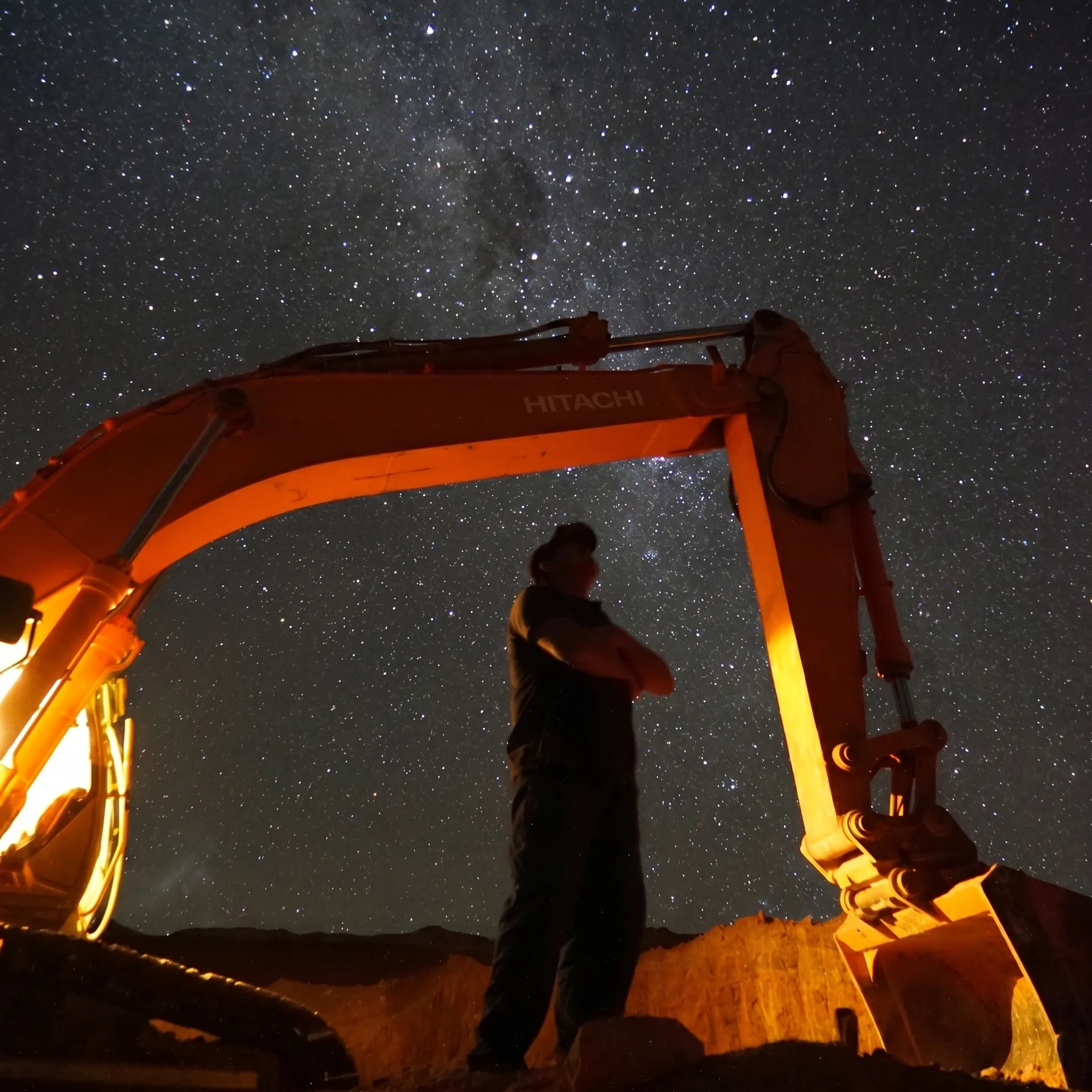Dan Measey looking at the stars under excavator