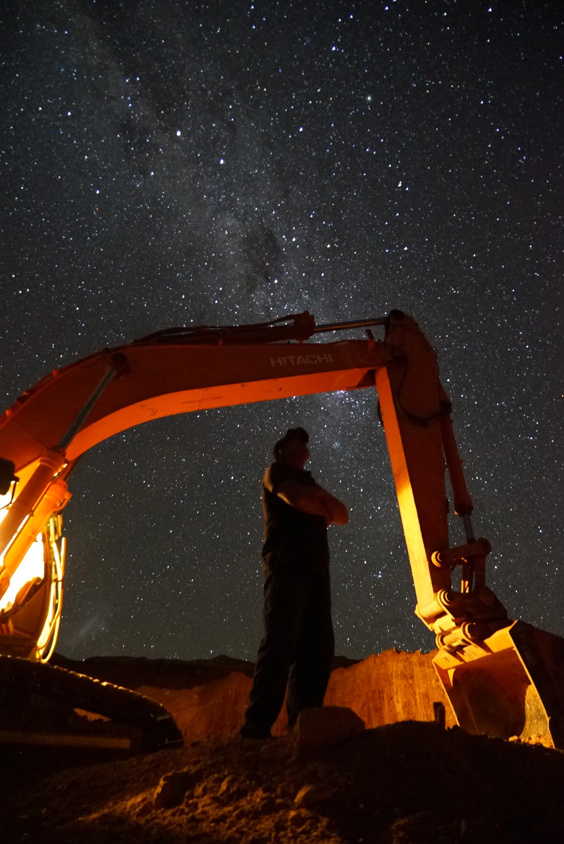 Dan Measey looking at the stars under excavator